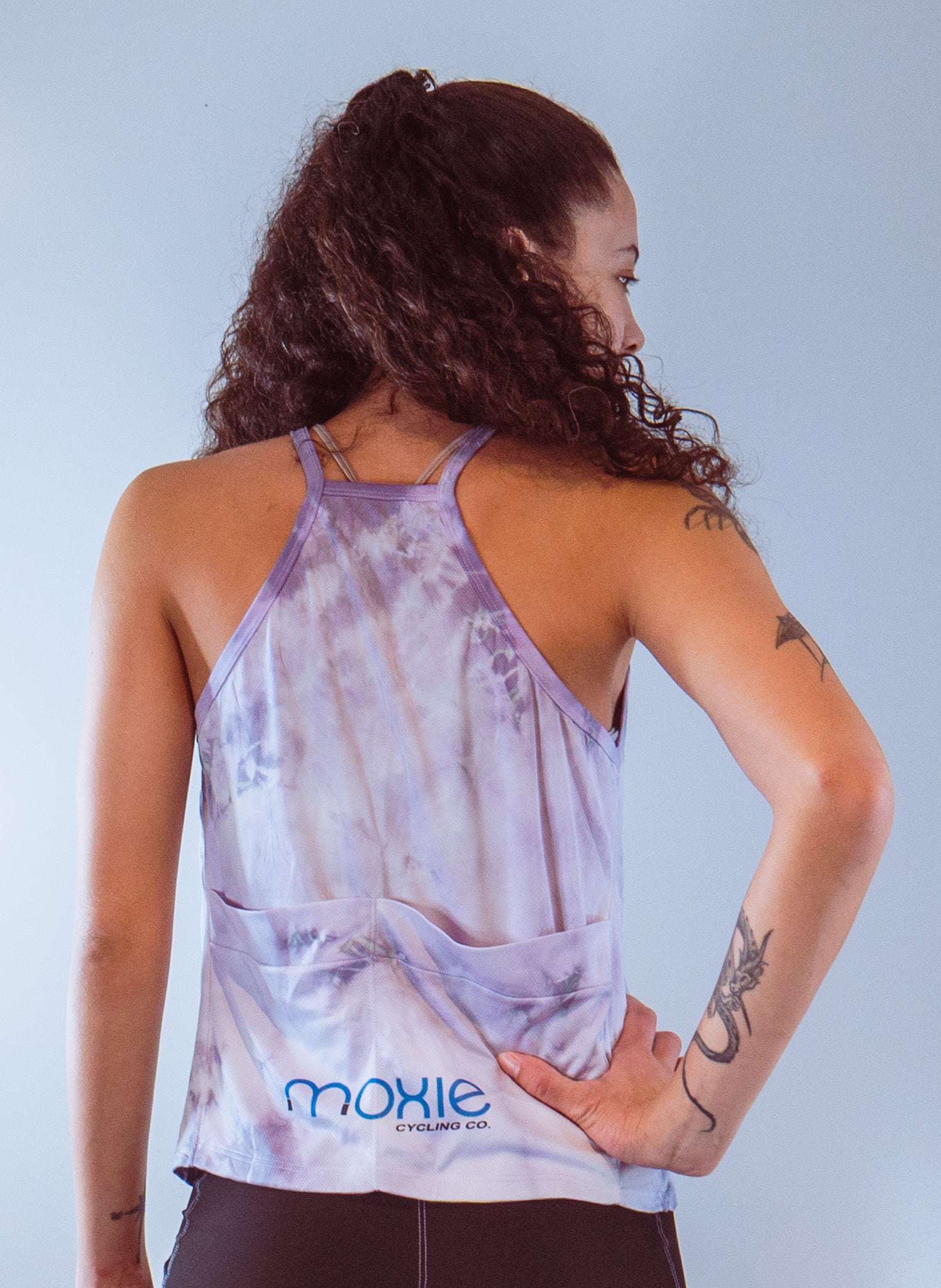 Women's sleeveless tie dye bike top with back pockets and performance spandex fabric